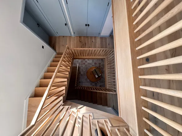 Bespoke multi-storey stairwell viewed from above, featuring quality carpentry and joinery by Big Sky Construction, Norfolk
