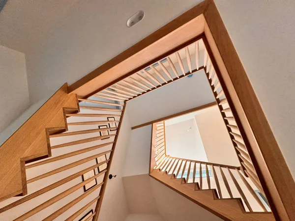 Open stairwell with quality timber construction looking upward  -  loft conversion by Big Sky Construction, Wymondham, Norfolk