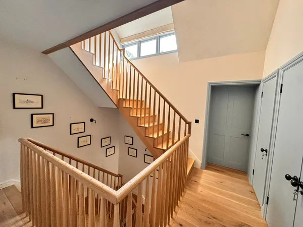 Stairwell renovation with quality painted timber balustrade and handrail installed by Big Sky Construction, Norfolk