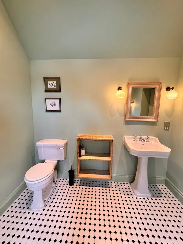 Fully tiled bathroom renovation with large-format floor tiles and wall tiling by Big Sky Construction, Wymondham, Norfolk